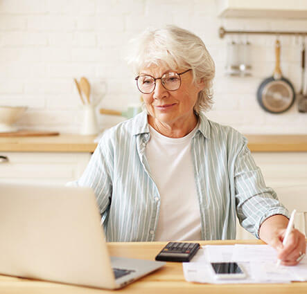 an image of an elderly woman using a computer